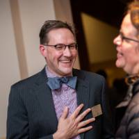 faculty talking and laughing together